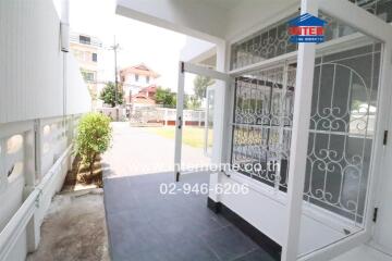 Covered entryway leading to outdoor area