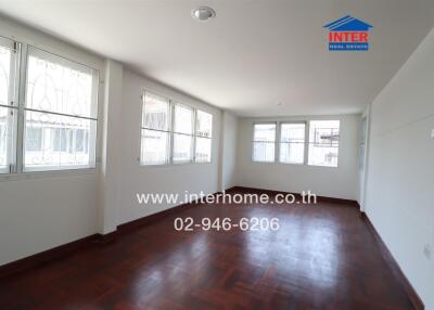 Spacious and well-lit living room with large windows