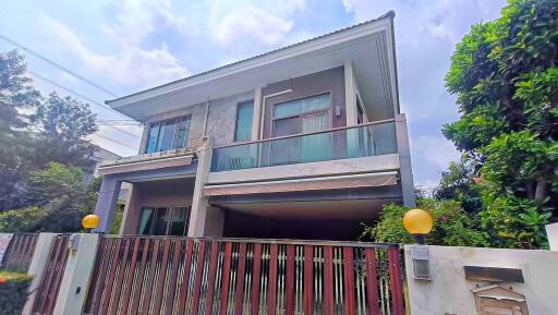 Modern two-story house with a balcony