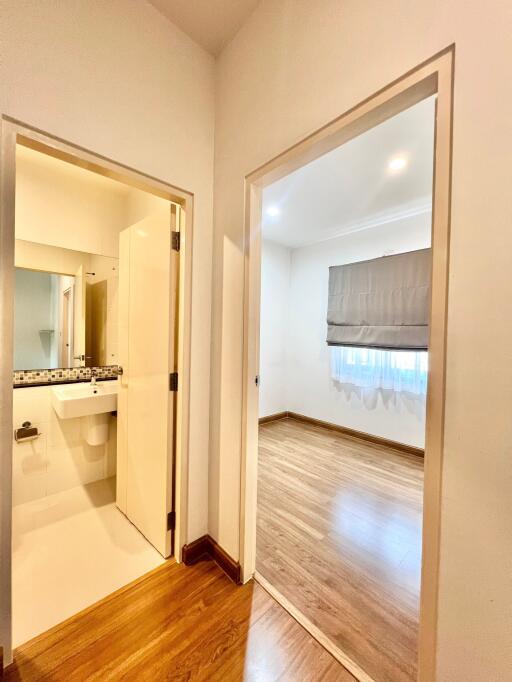 Hallway view with bathroom and bedroom