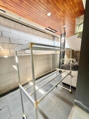 Spacious laundry room with drying racks