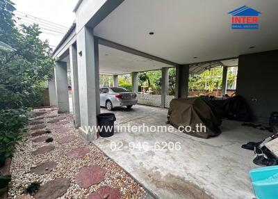 Residential garage with a parked car and covered motorcycles