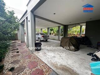 Residential garage with a parked car and covered motorcycles