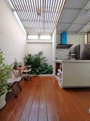 Modern kitchen area with skylight and indoor plants