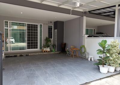 Spacious covered garage with tiled flooring