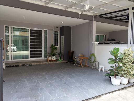 Spacious covered garage with tiled flooring