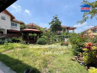 Beautiful garden area with gazebo and surrounding houses