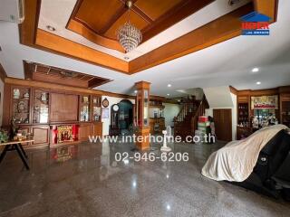 Spacious living room with a modern chandelier and a mix of traditional and contemporary décor