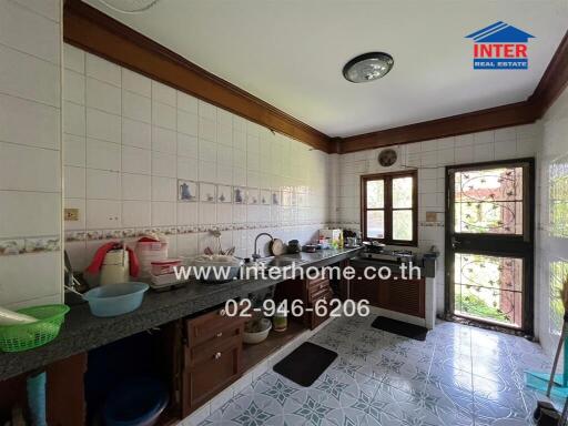 Traditional kitchen with tiled walls and countertops