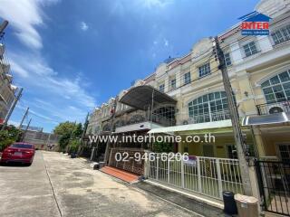 Street view of a residential building with clear sky