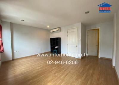 Spacious living room with wooden floor