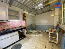 Kitchen with shelves, tiled backsplash, and open storage