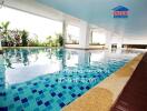 Modern indoor swimming pool with tiled floor