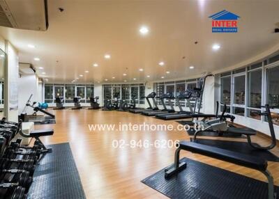 spacious fitness room with modern equipment