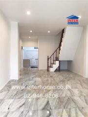 modern tiled living room with stairs leading to upper floor