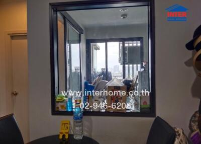 View into the kitchen through an indoor window