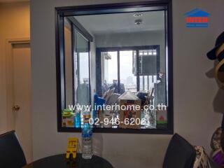 View into the kitchen through an indoor window