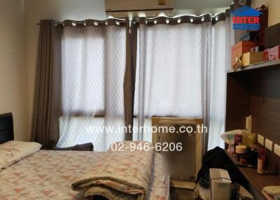 Bedroom with bed and window with curtains