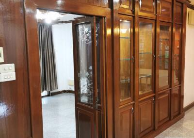 Living room with built-in wooden cabinets