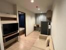 Modern living area with a view into the bedroom