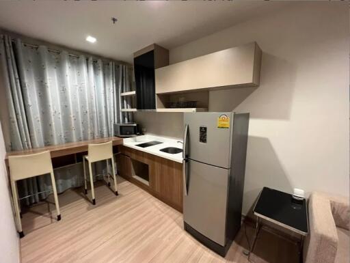 Modern kitchen with dining area and appliances