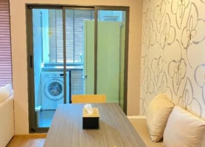 Dining area with wall seating and access to laundry room