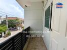 Balcony view with door and railing