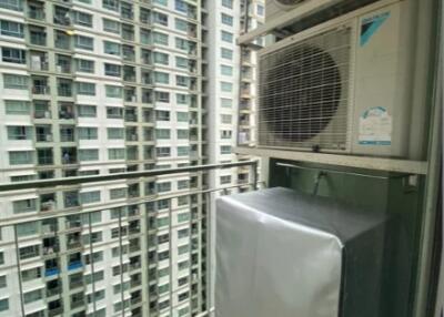 View of high-rise buildings from a balcony with air conditioning units