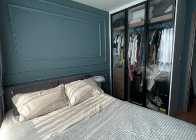 Master bedroom with bed and wardrobe