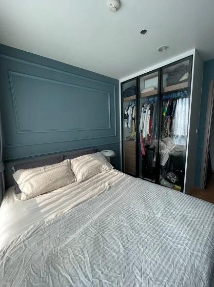 Master bedroom with bed and wardrobe