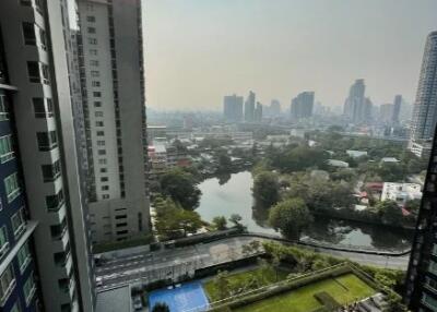 High-rise building with view of cityscape and swimming pool