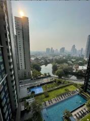 High-rise building with view of cityscape and swimming pool