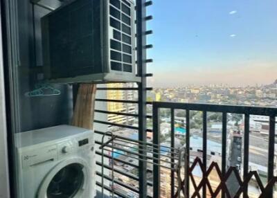Small laundry area with city view