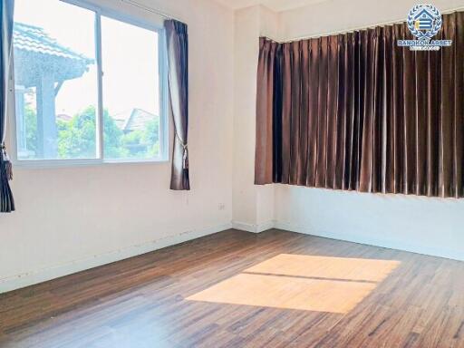 Bright and empty bedroom with large window