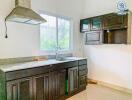 Modern kitchen with dark wood cabinets and stainless steel appliances