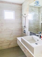 Modern bathroom with tiled walls and a sink