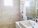 Modern bathroom with tiled walls and a sink