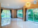 Spacious living room with large windows and garden view