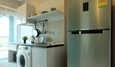 Photo of a modern kitchen with stainless steel appliances and stylish decor