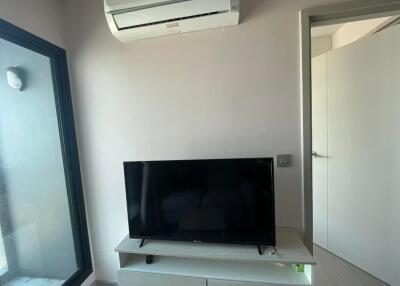 Small living room with a TV and air conditioner