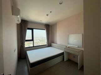 Modern minimalist bedroom with a large window view