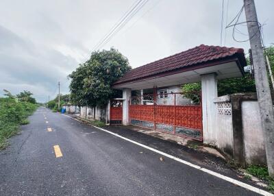 Gated Entrance of a House with Red Fence