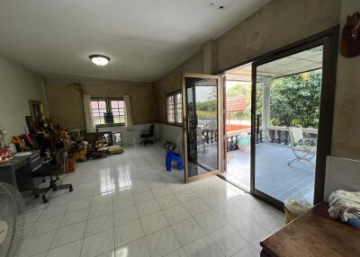 Spacious living area with large windows and outdoor access