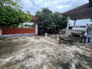 Spacious outdoor area with seating and plenty of greenery