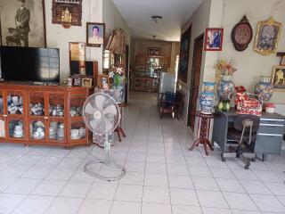 Spacious living room with traditional decor and furniture.