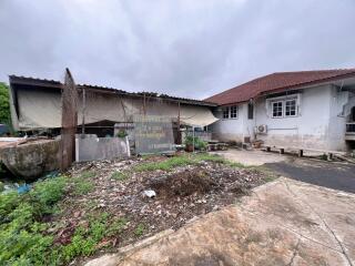 Exterior view of a property with surrounding yard