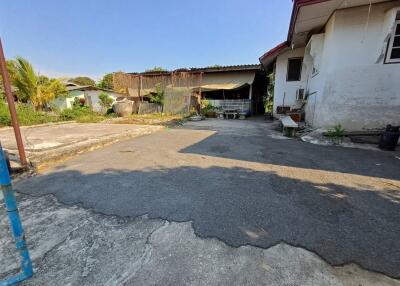 Outdoor yard with paved area and adjacent building