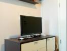 Modern living room with entertainment unit and wall shelf