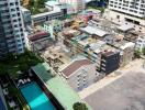 View from high-rise building showing cityscape and swimming pool