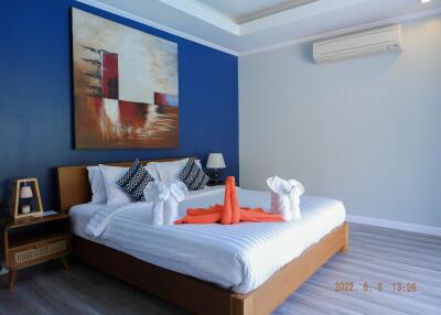 Modern bedroom with art and air conditioning